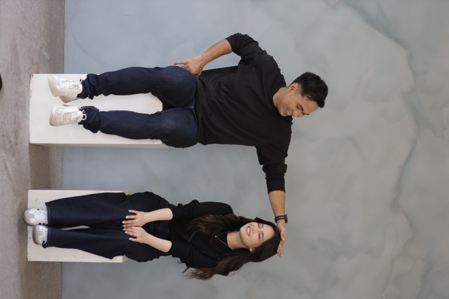 John and Alyssa laughing together in a casual studio portrait
